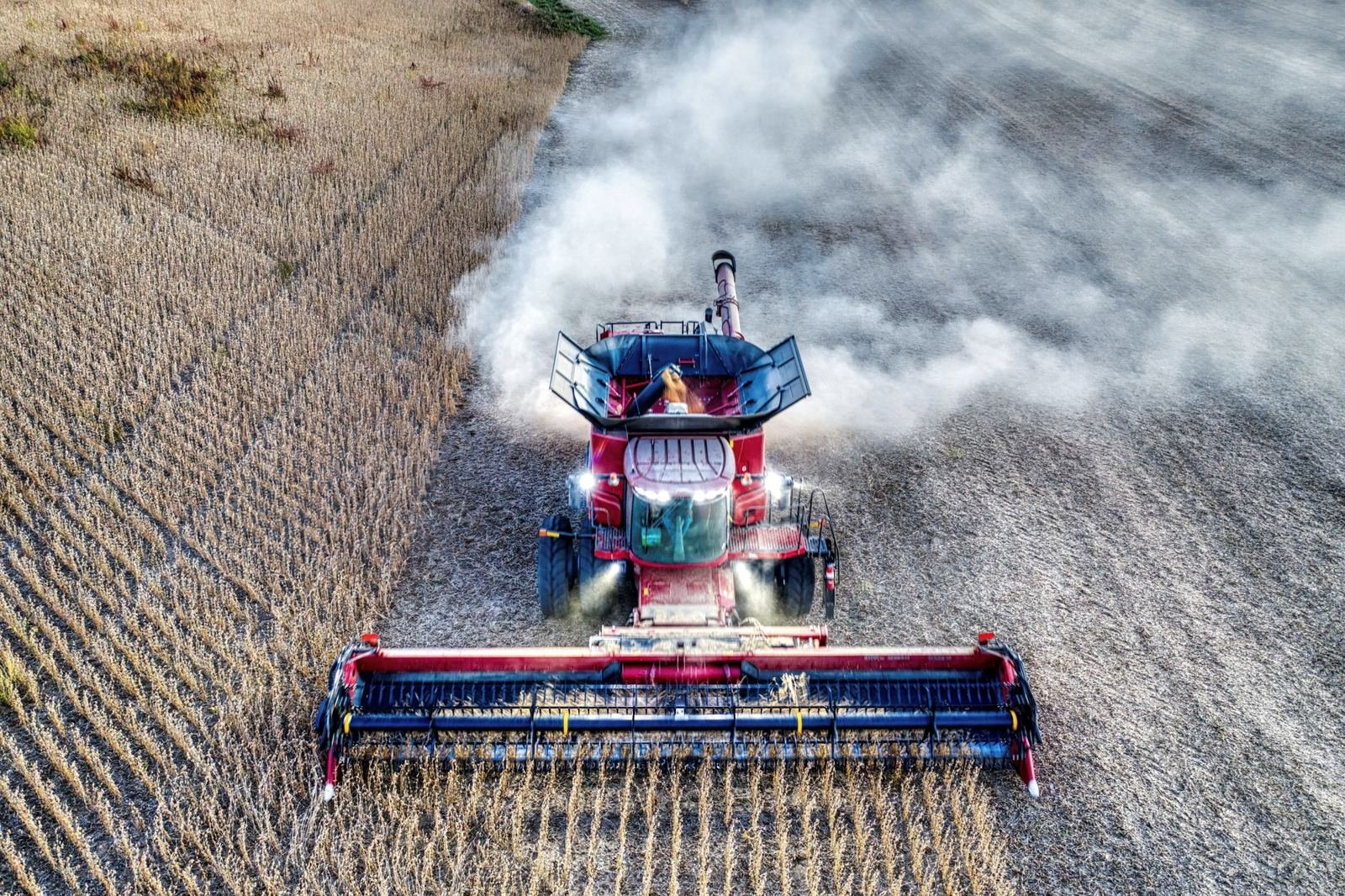 Combine harvester working a field, seen from above